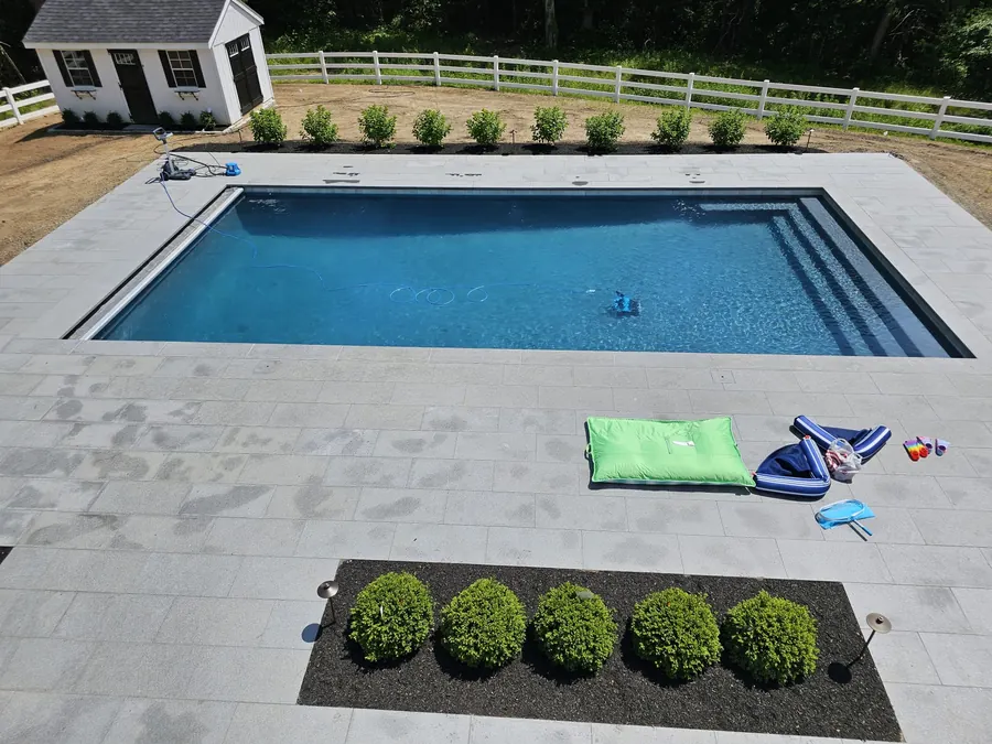 Rectangular pool with boxwood planting