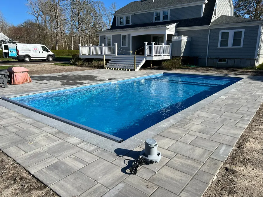 Bright blue pool behind a Cape house