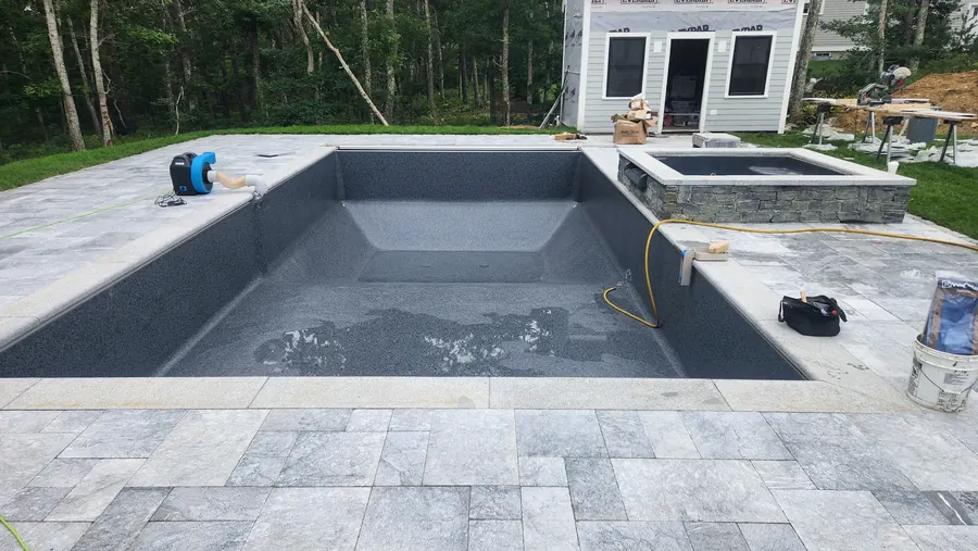 New pool shell with a raised spa under construction